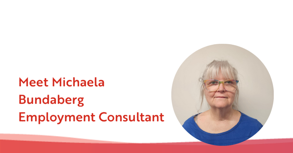 A smiling older woman with gray hair and glasses is shown next to text reading “Meet Michaela Bundaberg Employment Consultant” on a white and red background, highlighting her expertise in providing neurological support.